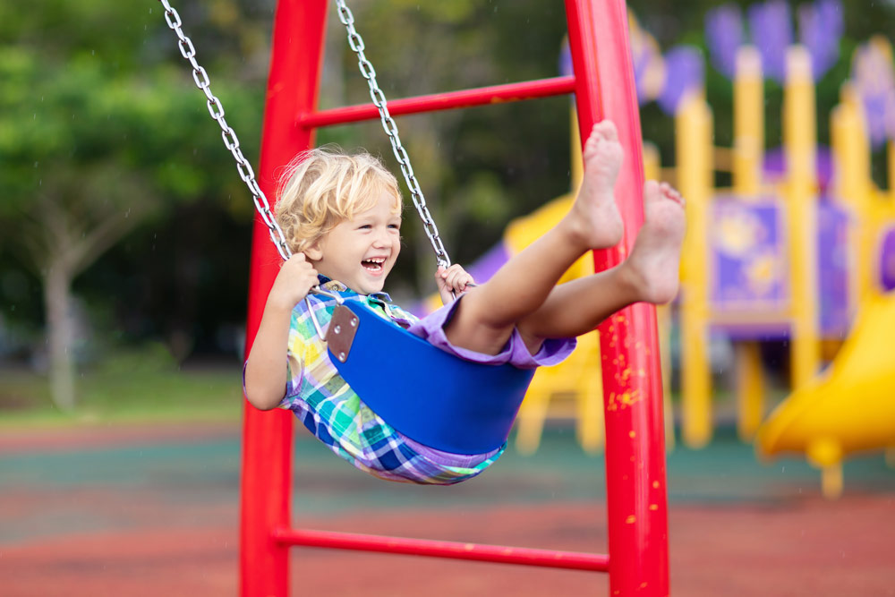 Child on swing at playground