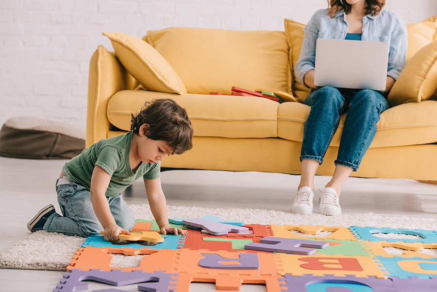Child playing with letter blocks